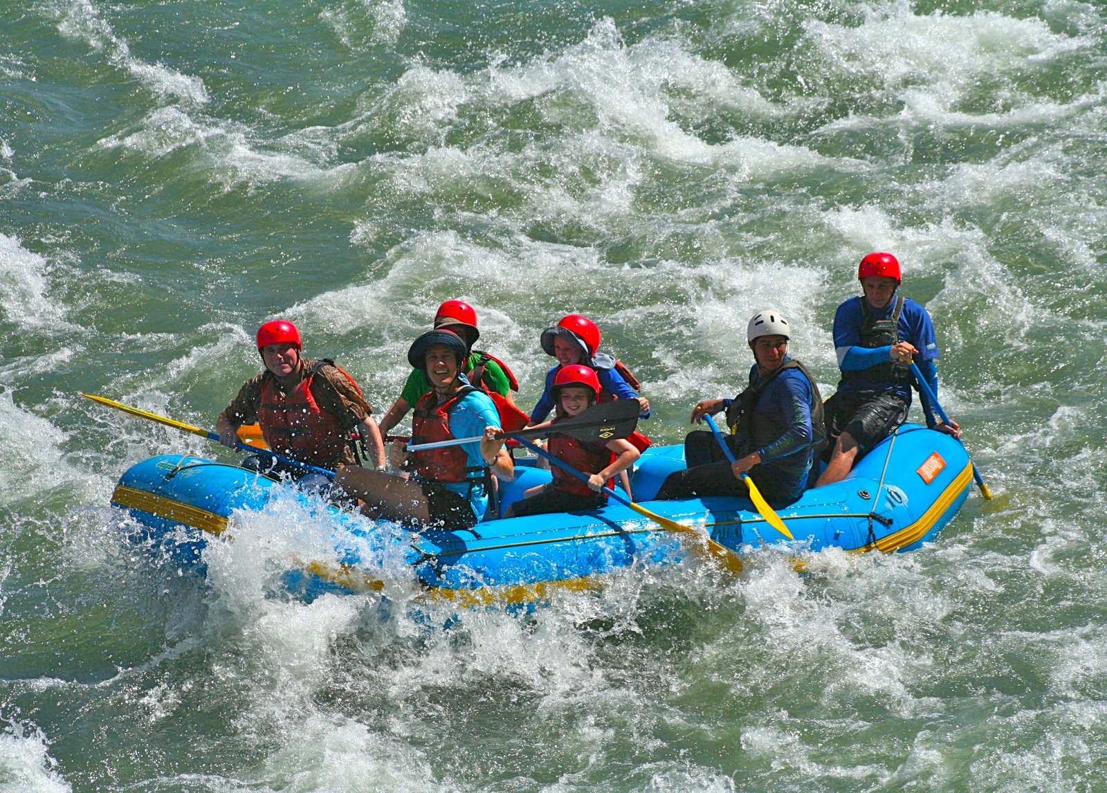 River rafting trips 2026 beginner guide with raft on tropical white water rapids